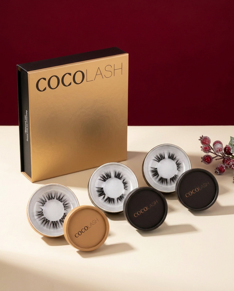 First Bloom Brown concept: closed gold CocoLash Kit with three single-lash packs, one gold and two black